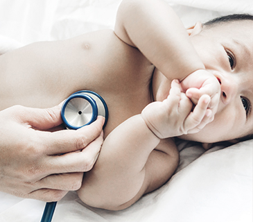 Doctor examines baby