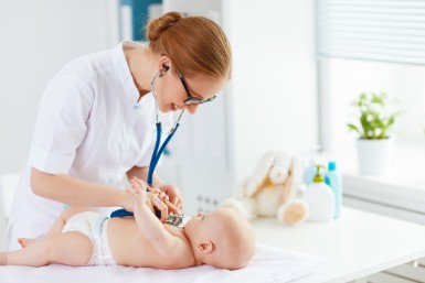 Doctor holds baby