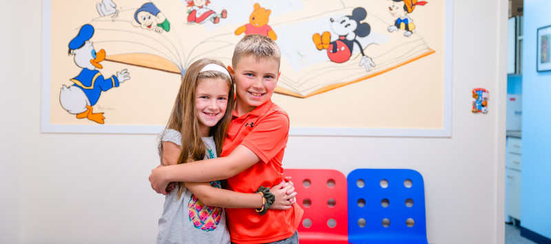 Siblings embrace