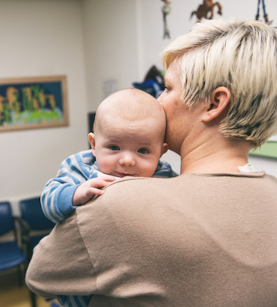 mom holds baby with bladder exstrophy