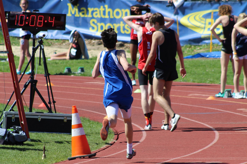 Teens run past finish line at track meet