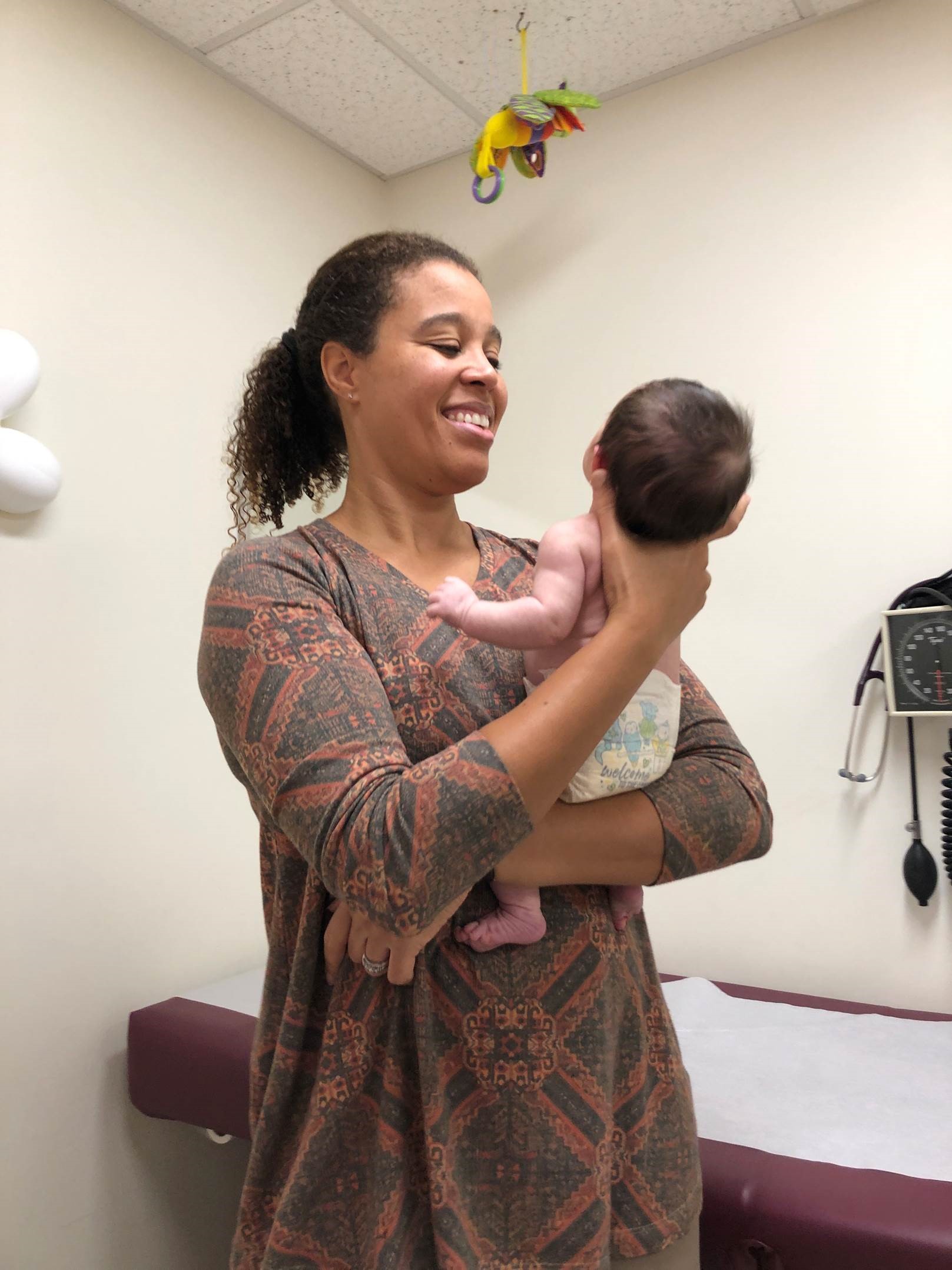 young woman holding a baby