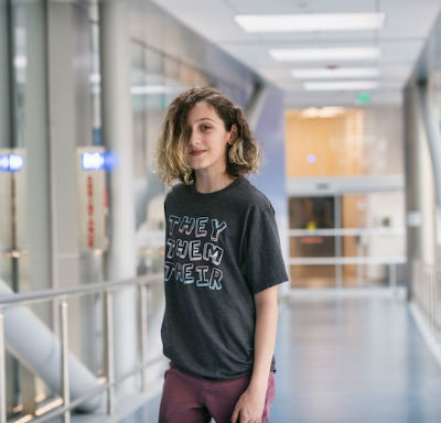 GeMs patient stands in hallway at hospital