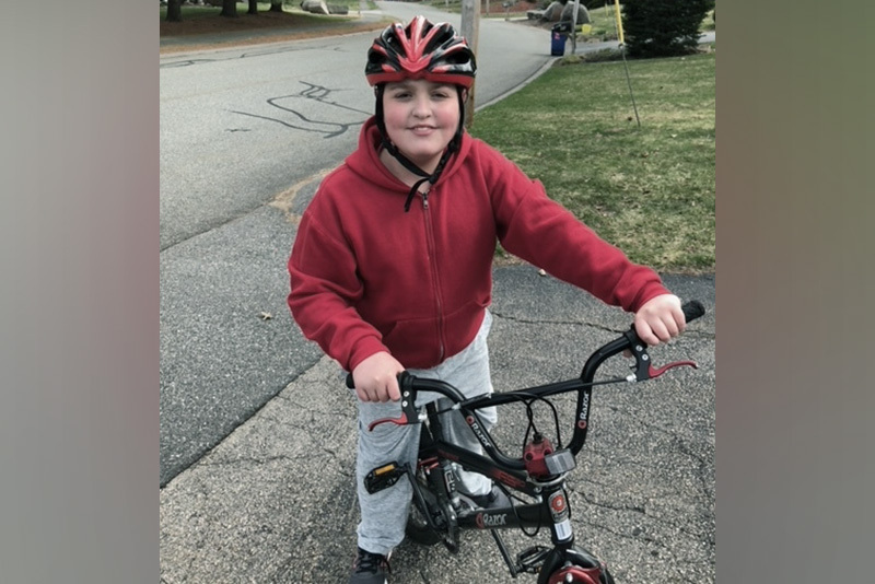 Boy rides a bike