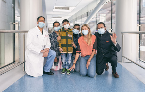 Priyanshu with his parents and care team at Boston Children's