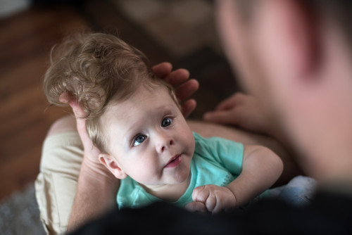 A young boy has eyes wide open when looking at his father