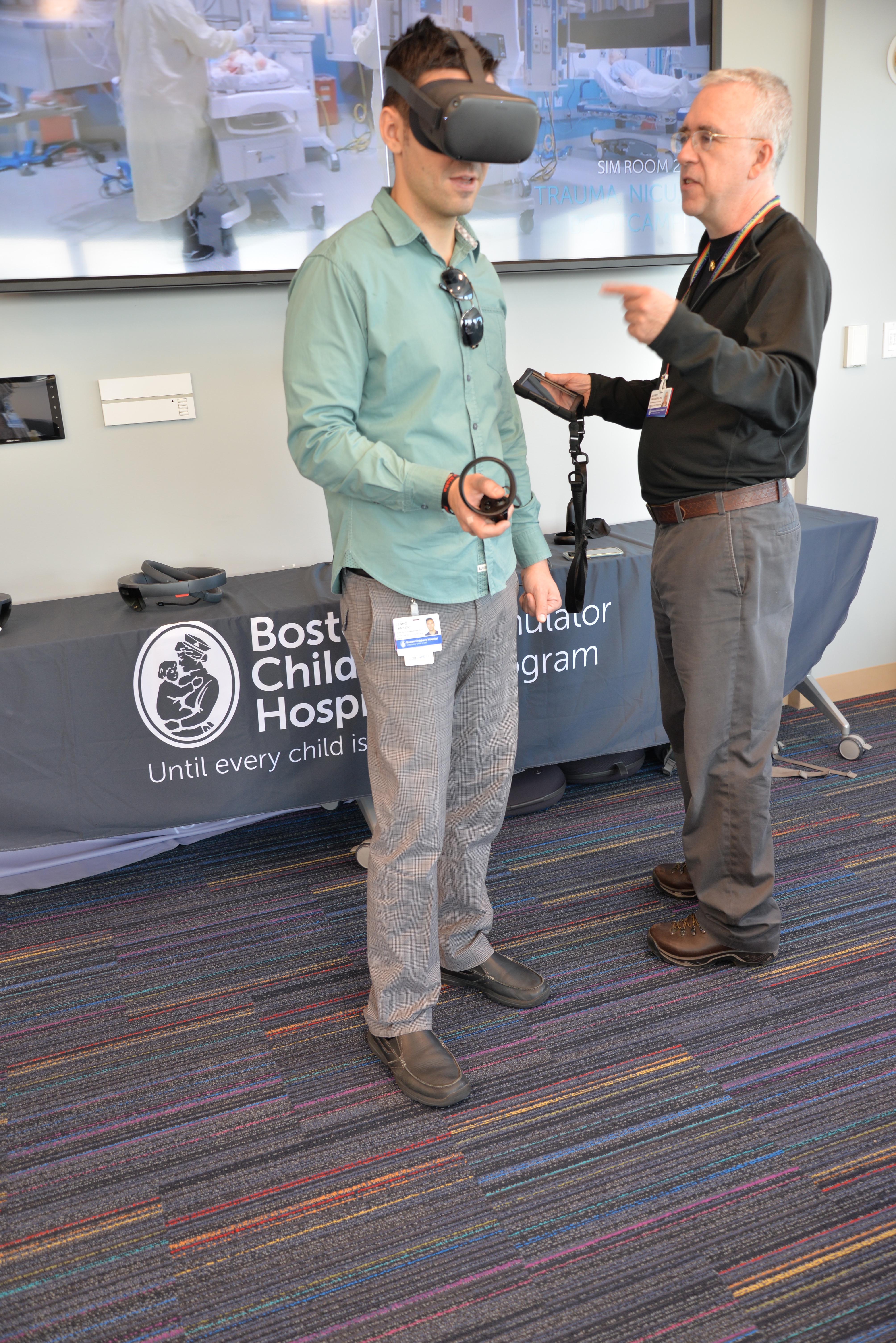 A man uses a VR device to view and practice a simulation.