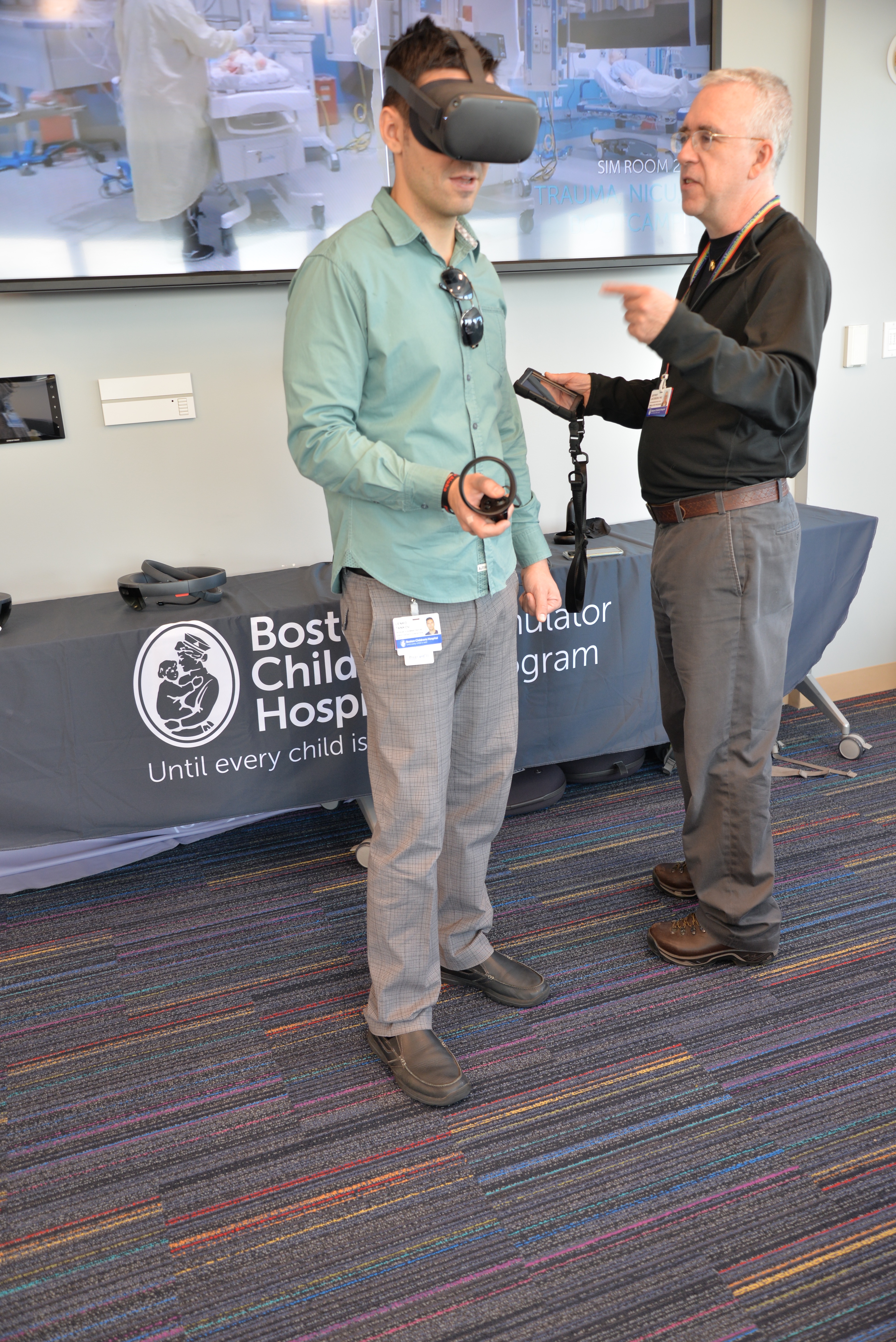 A man uses a VR device to view and practice a simulation. 