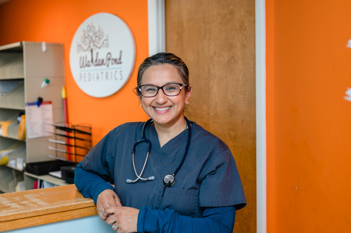 a woman medical provider smiling