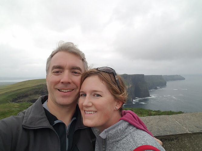 Erin with her partner at the Cliffs of Moher.