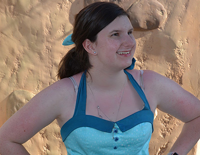 Teen girl smiling as she stares at the sun