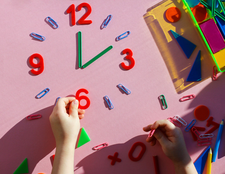 child toy clock on a wall