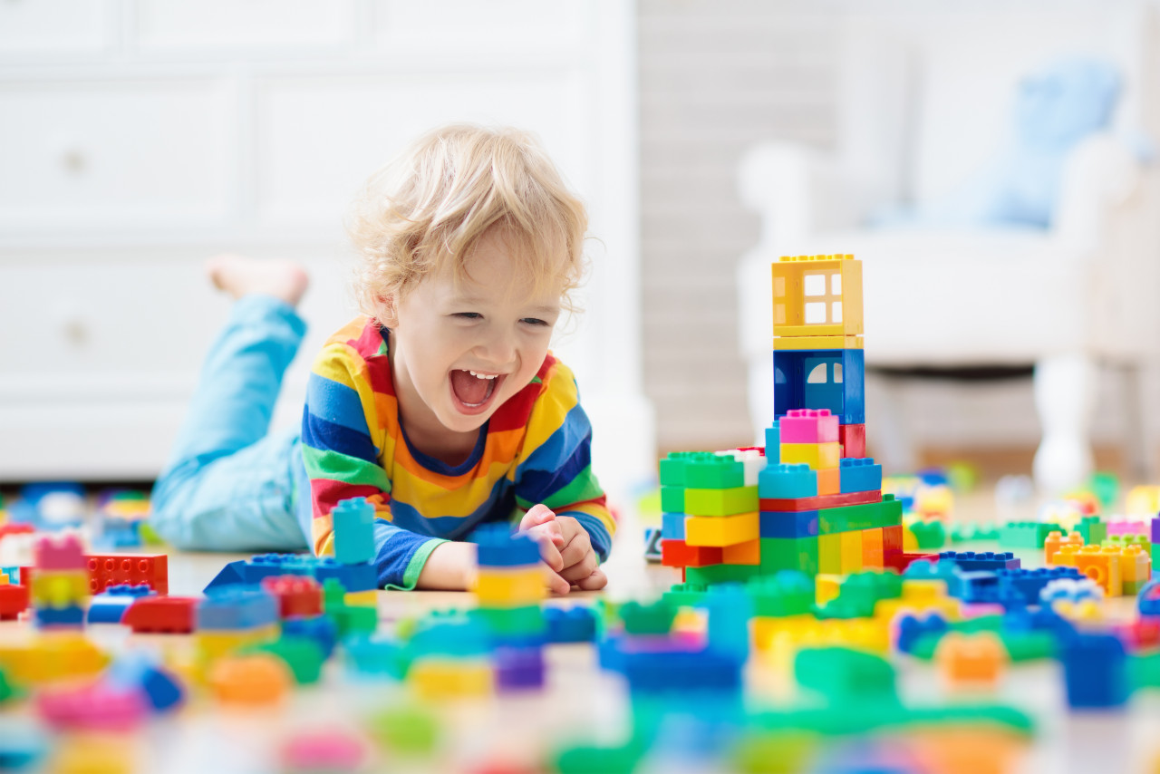 a child playing with building blocks