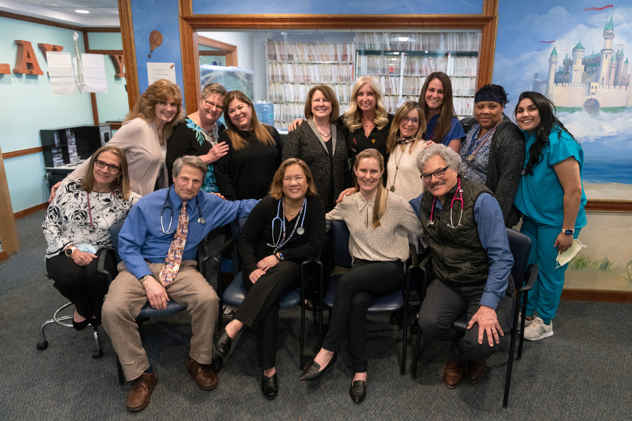a group of medical professionals smiling at the camera