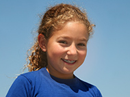 young girl in blue shirt