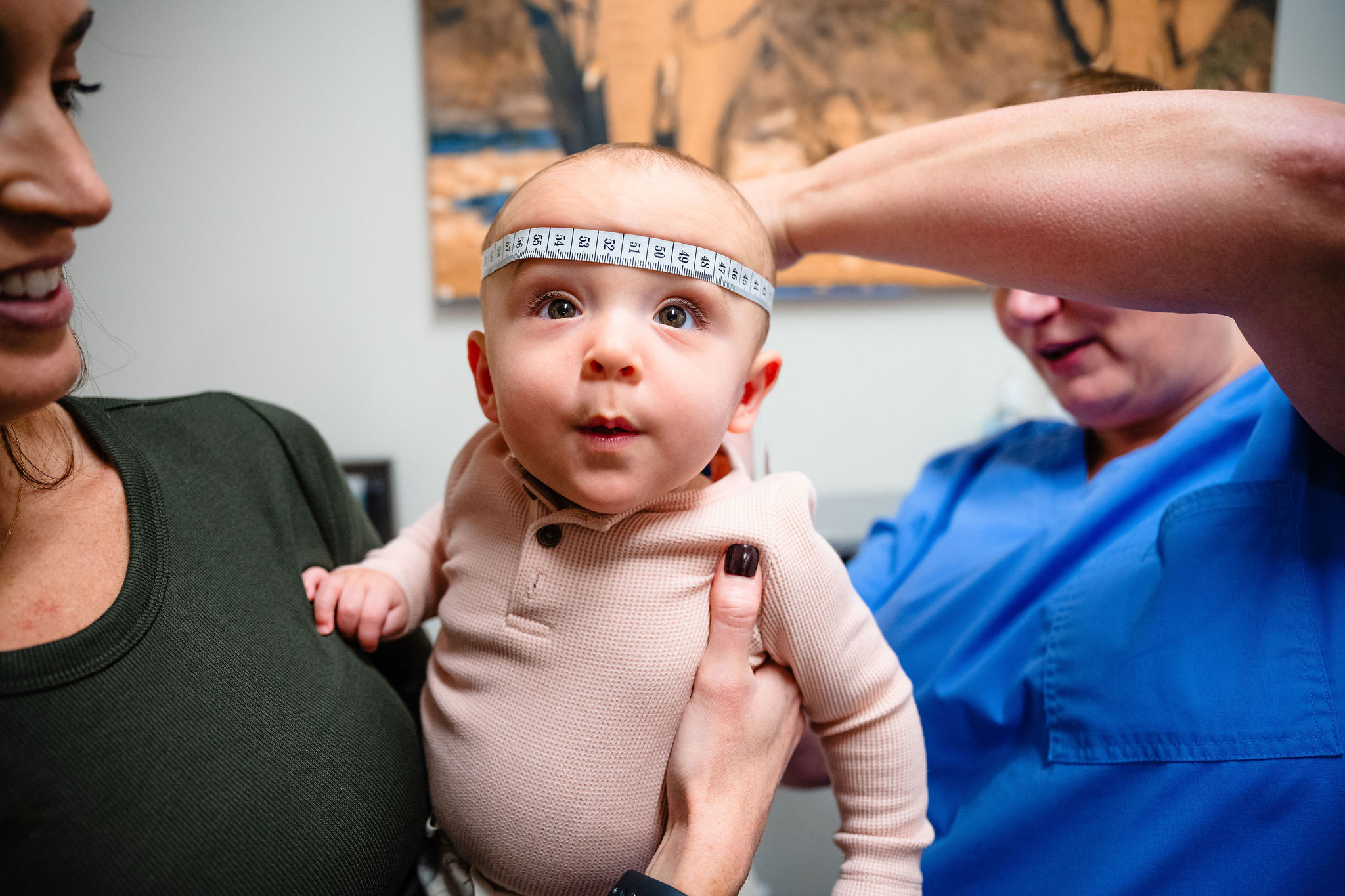 a baby's head being measured