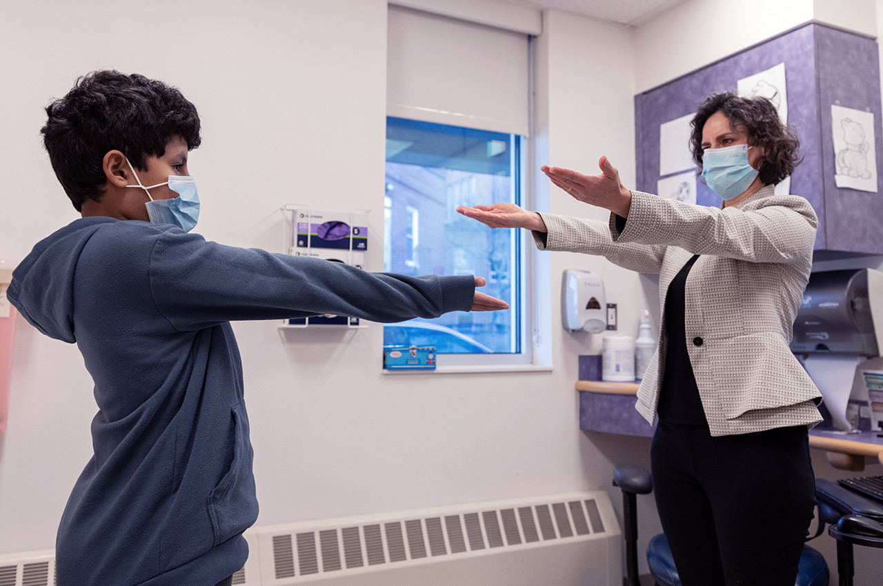 a boy and his mom with outstreched arms toward each other
