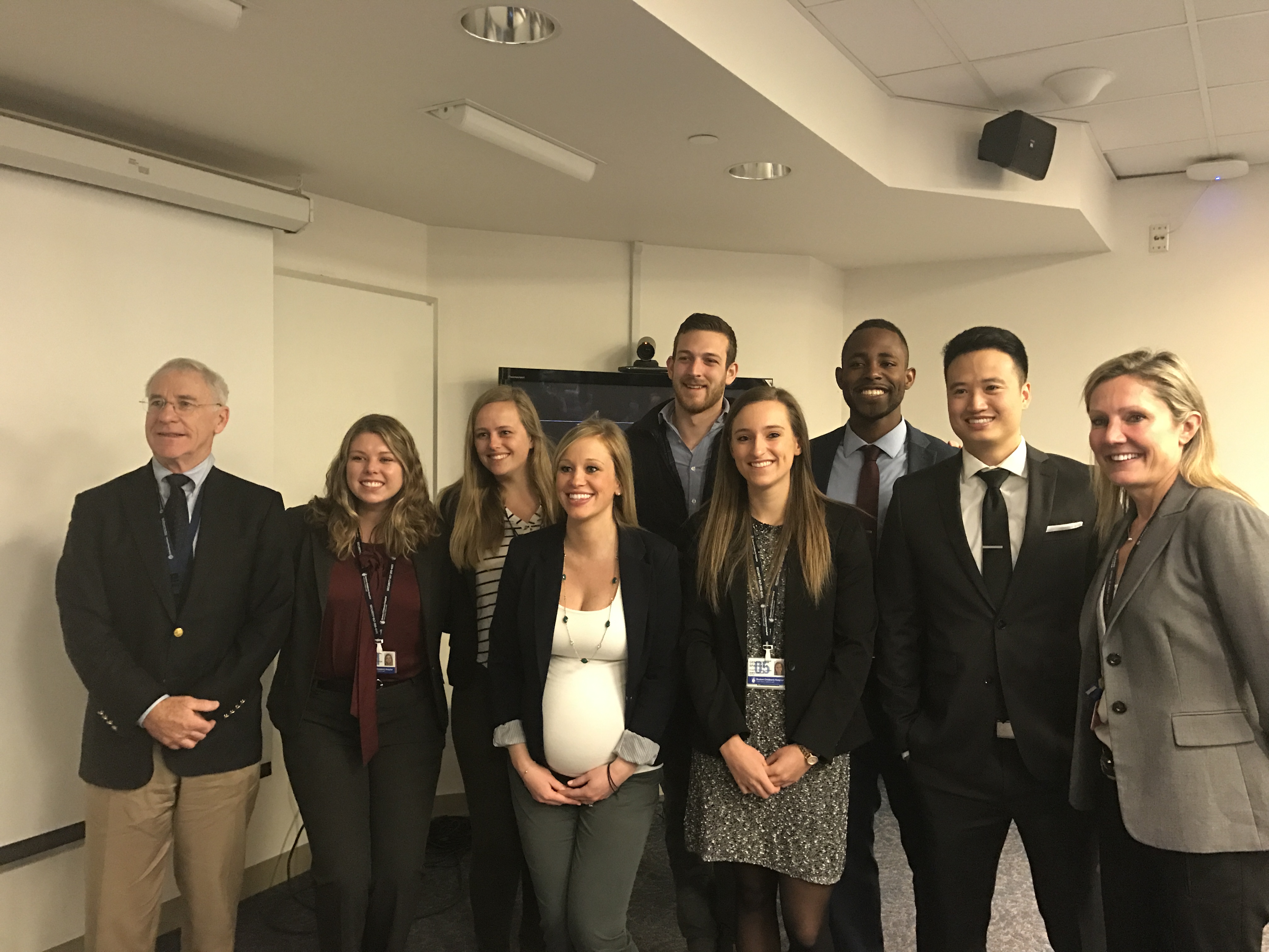 2017 Pacari interns posed in a group photo, men and women