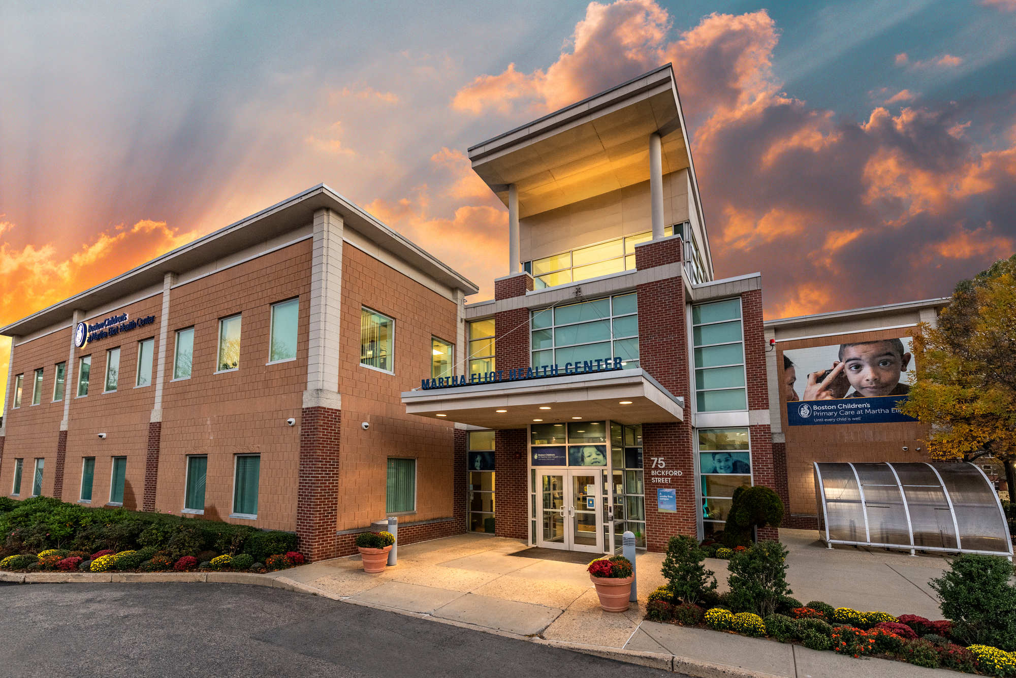 Exterior of Boston Children's at Martha Eliot at sunset