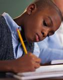 Student writes in class