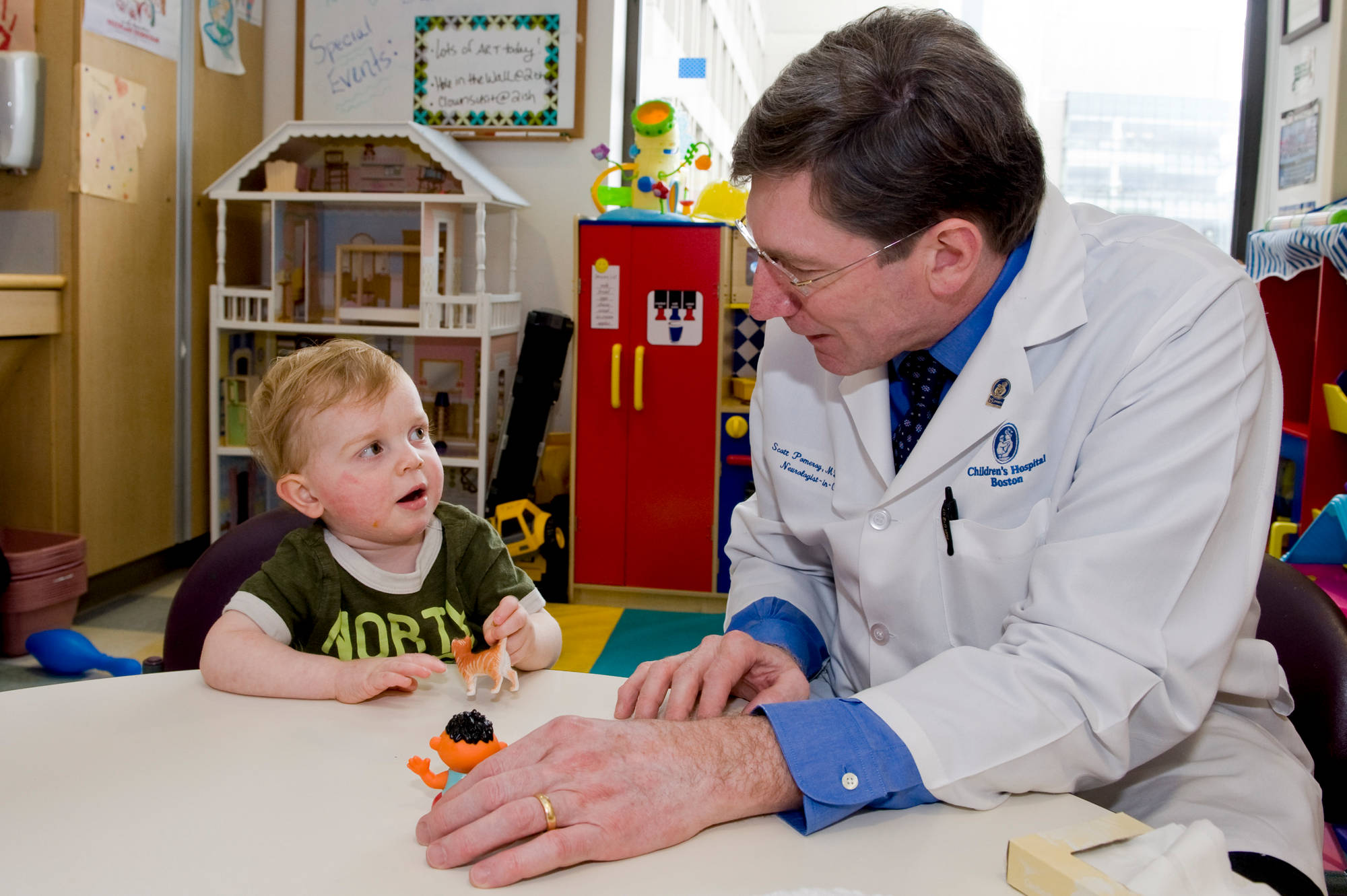Current chief of neurology at Boston Children's, Scott L. Pomeroy, MD, PhD, is shown with a patient.