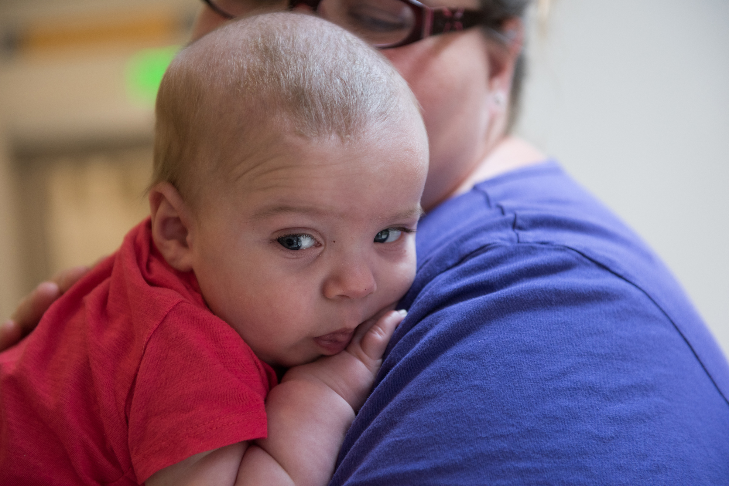 Silas is held by a woman