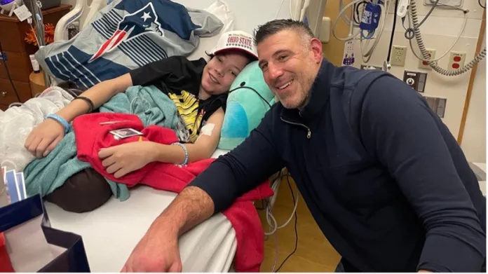 Mike Vrabel sitting next to bed of Boston Children's Hospital patient