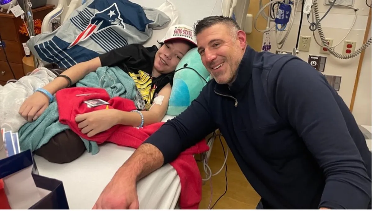 Mike Vrabel sitting next to bed of Boston Children's Hospital patient