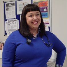 a woman with a stethoscope around her neck