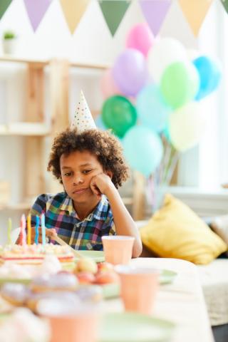 Child is alone at a birthday party