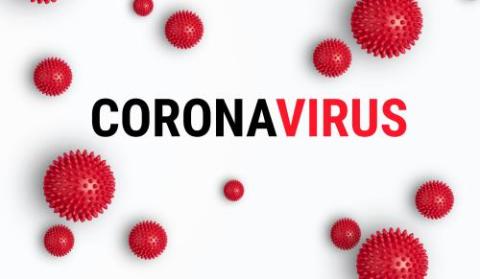 word coronavirus surrounded by red blobs
