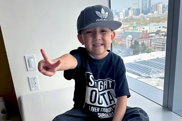 Boy points two fingers