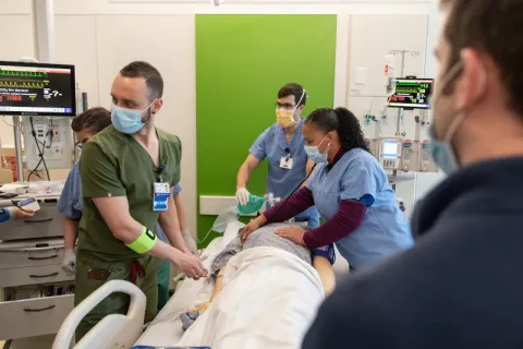 Clinicians participate in simulated operation